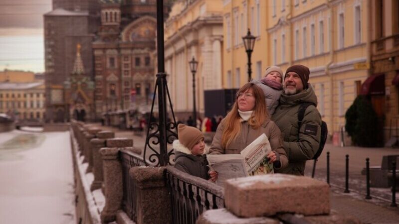 family in saint petersburg near church of the savior on spilled blood